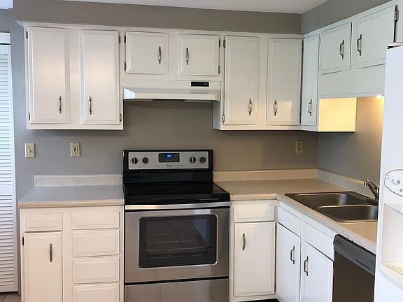 Light, bright kitchen with stainless steel and white cabinets