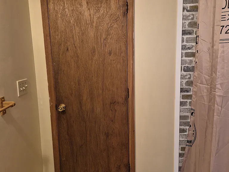 view from inside bathroom, from window toward door