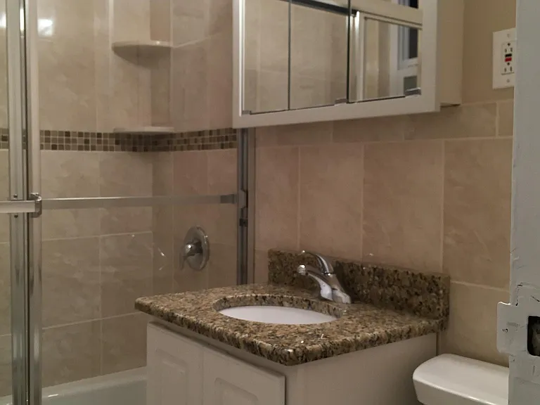 bathroom shower with shelves