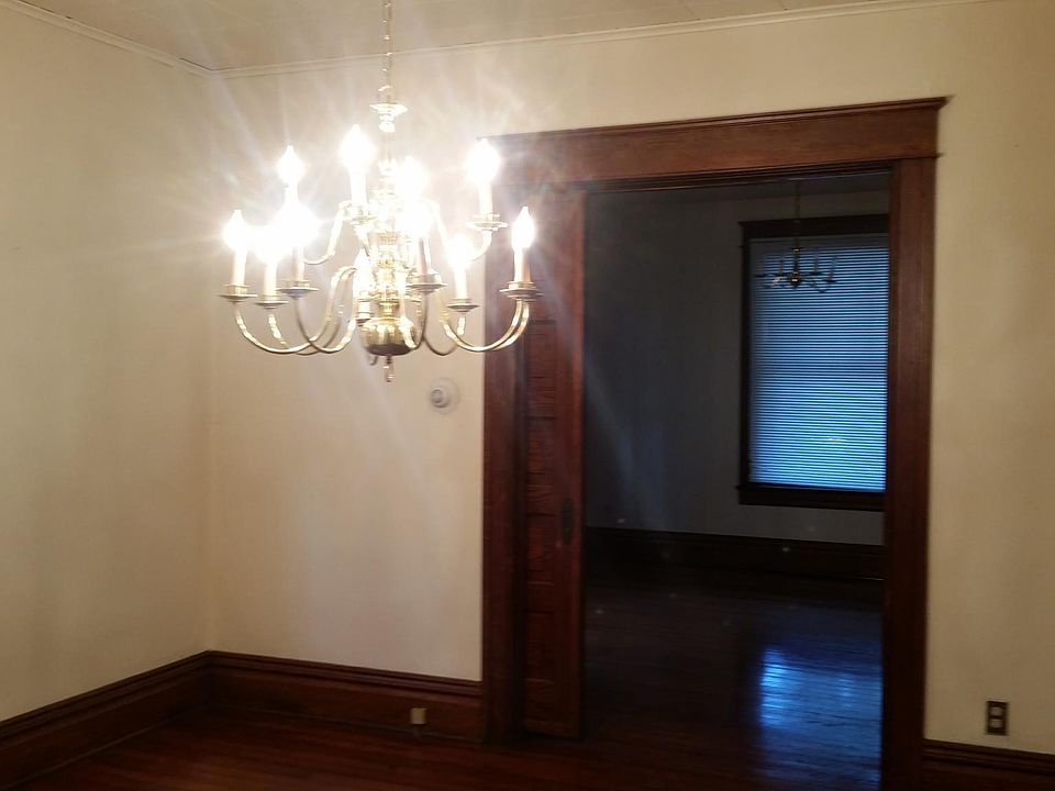 Dining room or living area, hardwood floors, and pocket door