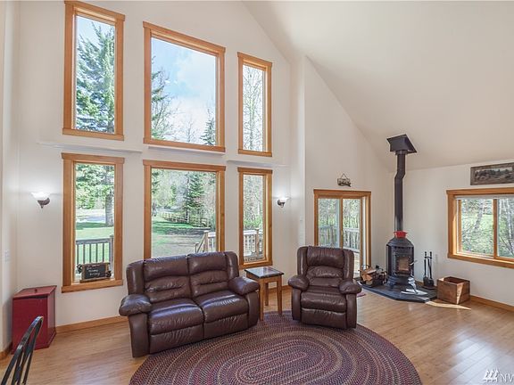 Cathedral ceiling and picture windows to enjoy the river view