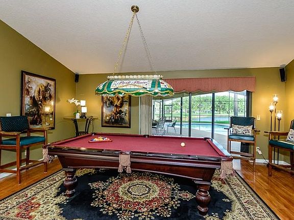 The formal living room is currently used for Billiards