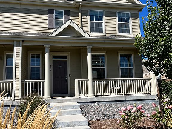 Front porch overlooking walking path and green space
