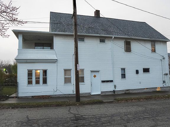 Side of house, entrance for unit 1