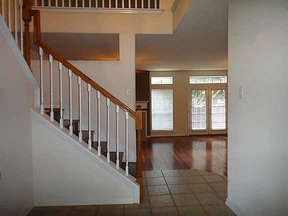 Tile entry with soaring high ceiling!