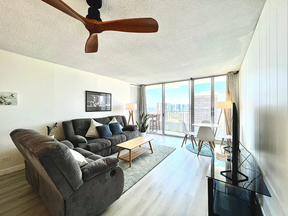 Living Room. 2 Reclining sofas, coffee table, 58" Smart TV w/ stand, ceiling fan - 1515 Ward Ave #1603