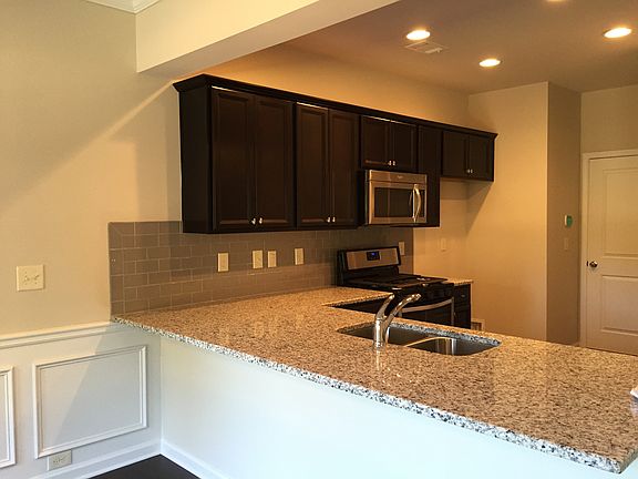 Kitchen Overlooks Dining and Great Room