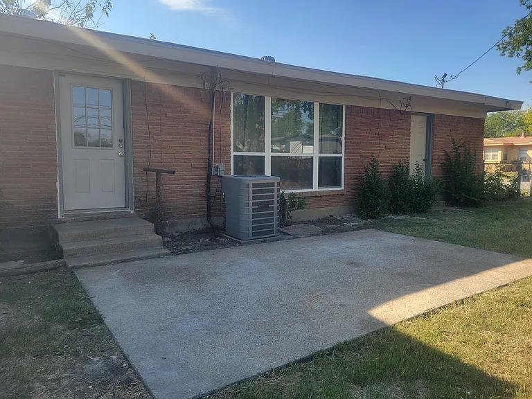 Back of house. New high efficiency air conditioning. Extra large patio .