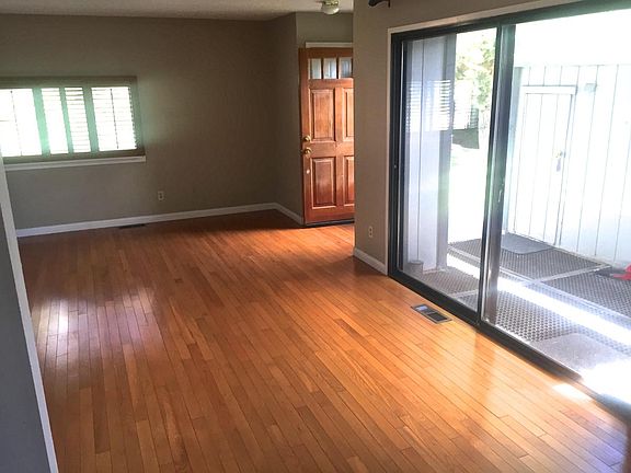 Living room and dining area with wood floors