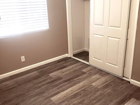 Bedroom 2: New floors, paint, blinds & ceiling fan