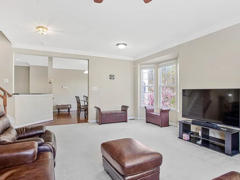 Sunlight fills every corner of this living room, giving the space an airy, welcoming feel from the moment you walk in.