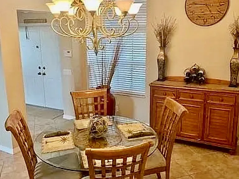double door entry to foyer with open concept dining room living room area