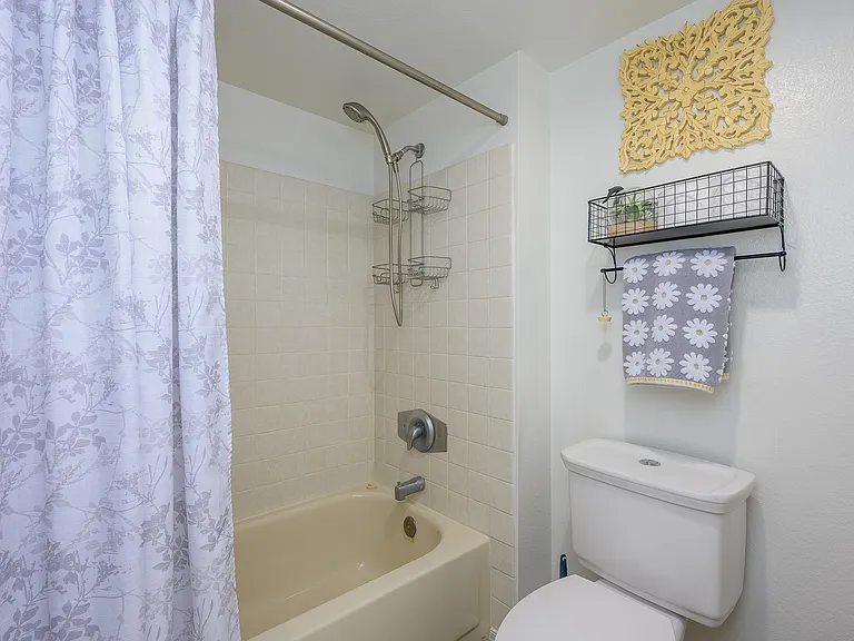 Shower/tub combo in private area.