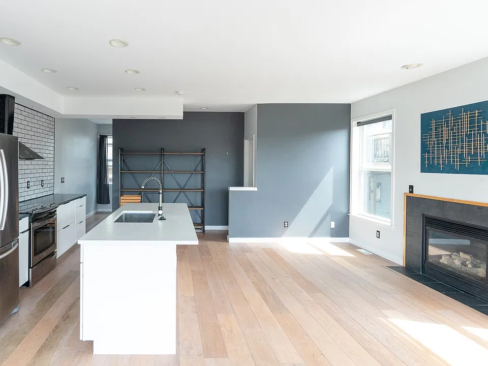 Gas fireplace for cozy winter days. Just flip a switch! Shelving unit on back wall can be left for tenant use or removed.