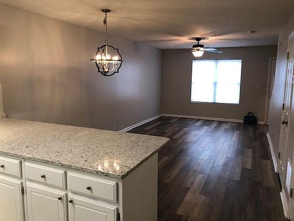 Beautiful new plank flooring and new light fixture.