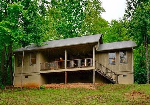 Front of house, now has garden beds and storage under house