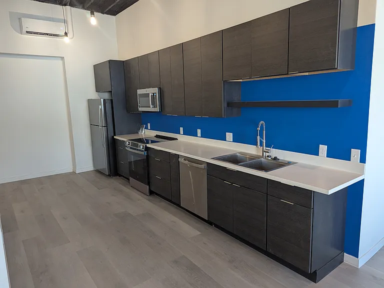 Full kitchen with stainless steel appliance suite