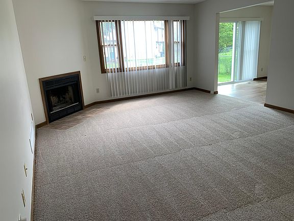 Living room with wood burning fireplace