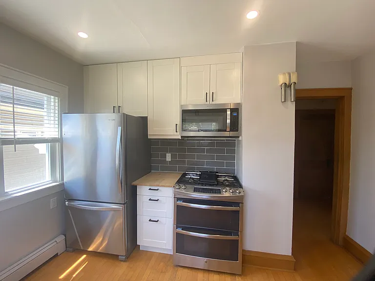 Kitchen - Stainless steel fridge, stove and microwave