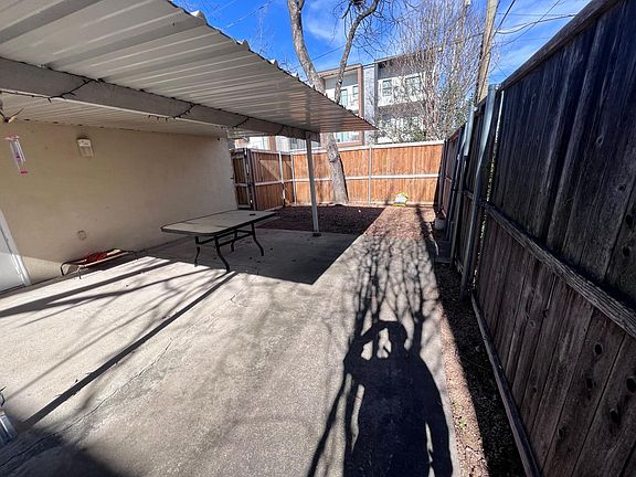 Covered patio with 10 foot privacy fence