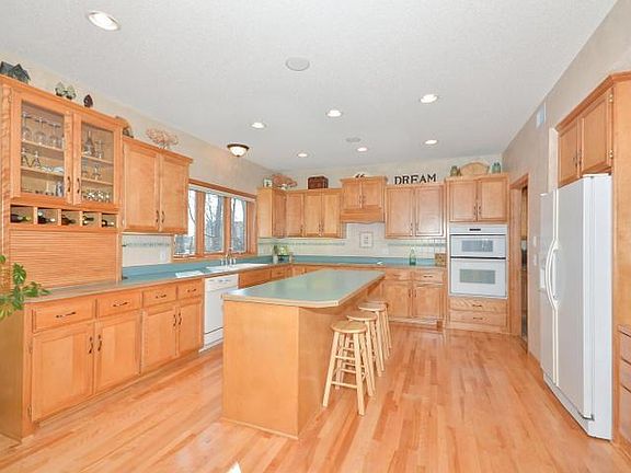 The huge kitchen is sure to delight the cook in the family!  The large center island allows for wonderful work space and perfect place for friends and family to gather. There's also the convenience of a desk area.