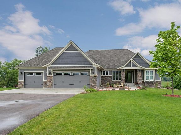 A gorgeous custom built home is perfectly sited on the acreage & offers quality & character throughout.