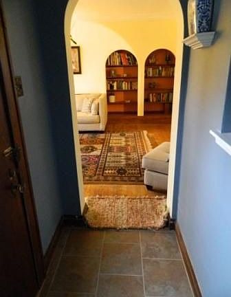 Newly tiled entry/ built in bookshelves