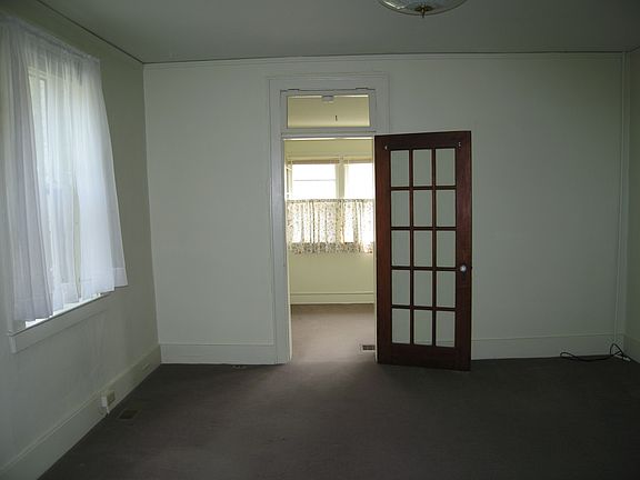 North east corner of living room with view to bedroom 2