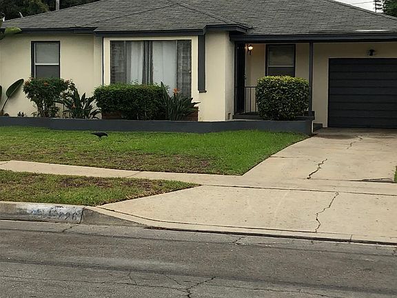 House with view of garage included