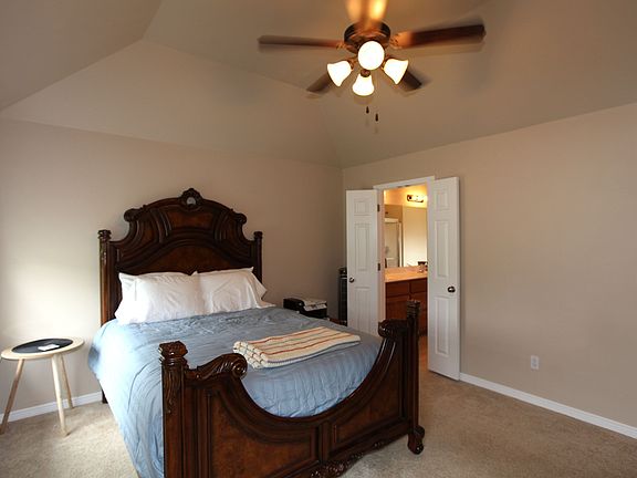 Master has vaulted ceilings, ceiling fan.