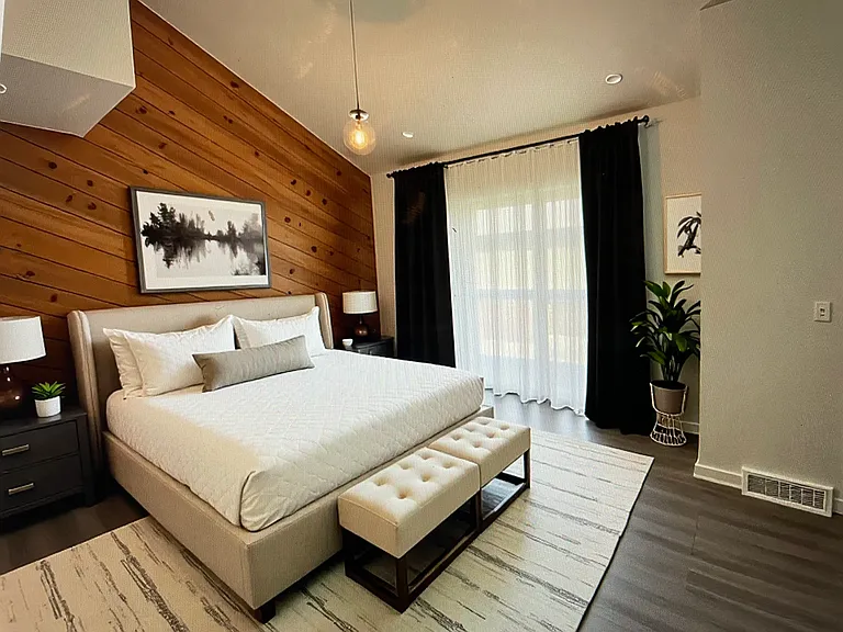 Master bedroom with large sliding door virtually staged