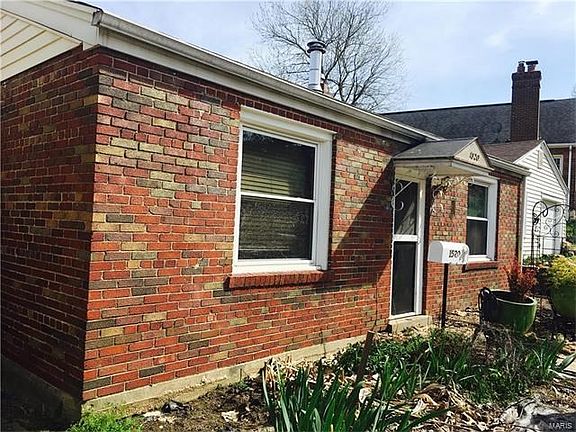 Brick home on double lot near Franz Park in Dogtown, ready for renovation or new development.