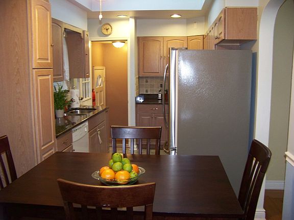 kitchen with new appliances and granite counter