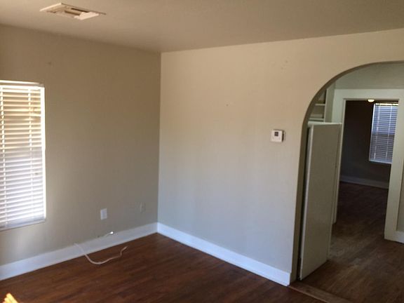 Living room leading into the kitchen.