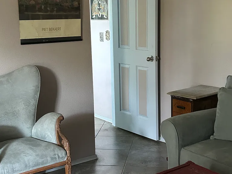 Through this door is the rest of the suite.