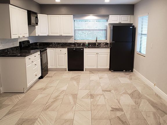 Walk in and looking right into kitchen