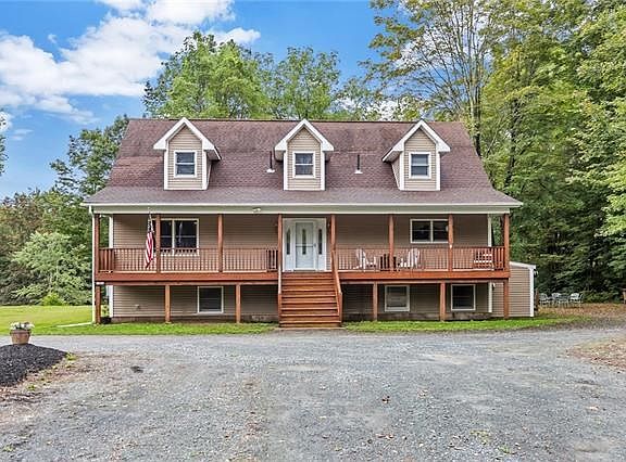 Spacious Cape Cod home with seven bedrooms, 3.5 baths and 2 kitchens has room for the entire family