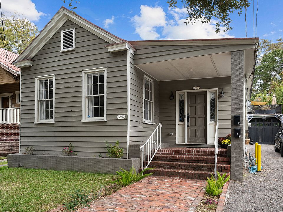 Small front porch and small yard. 
Grass is maintained and is included