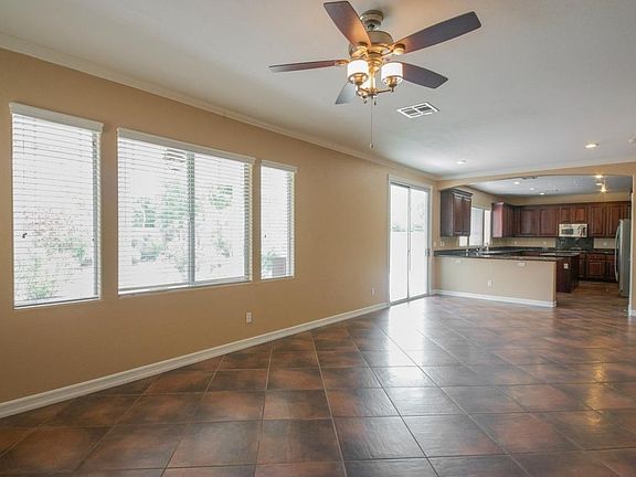 Large family room opens to kitchen with sliding glass door t
