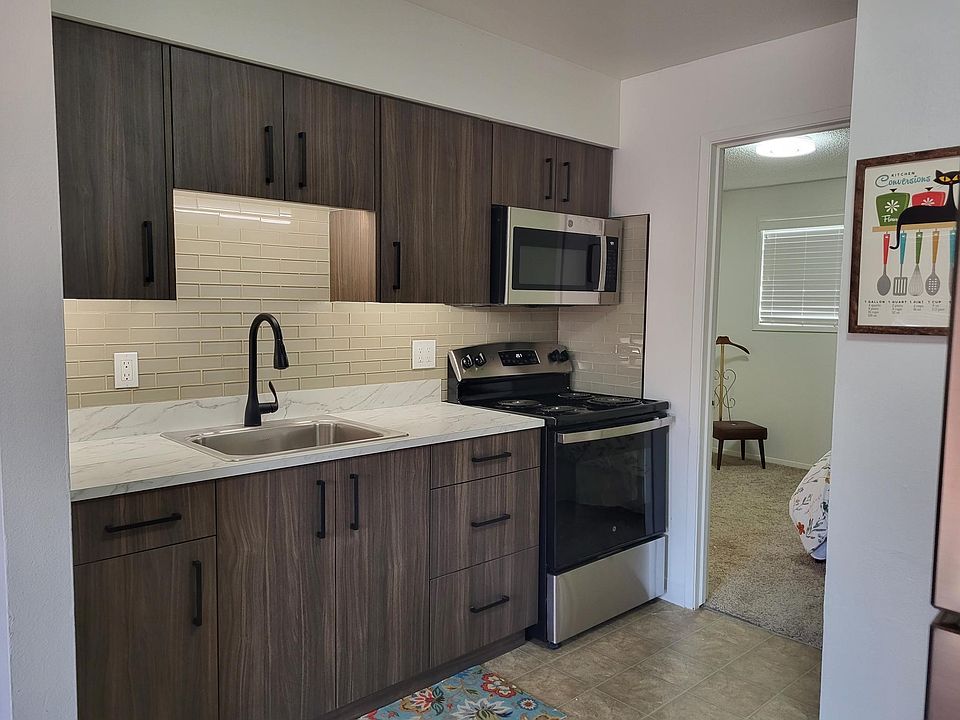 New kitchen cabinets, large single well sink.