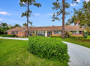 320 N Country Club Dr, Atlantis, FL 33462