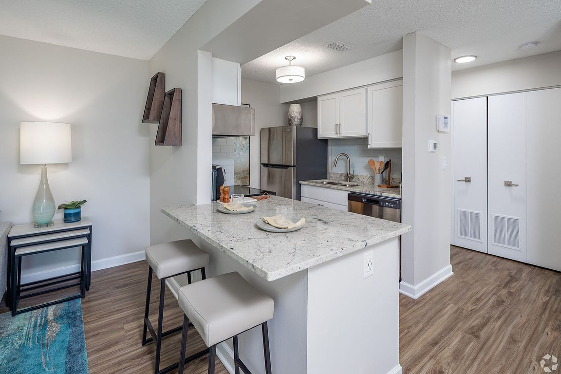 Kitchen with granite counters and modern cabinetry