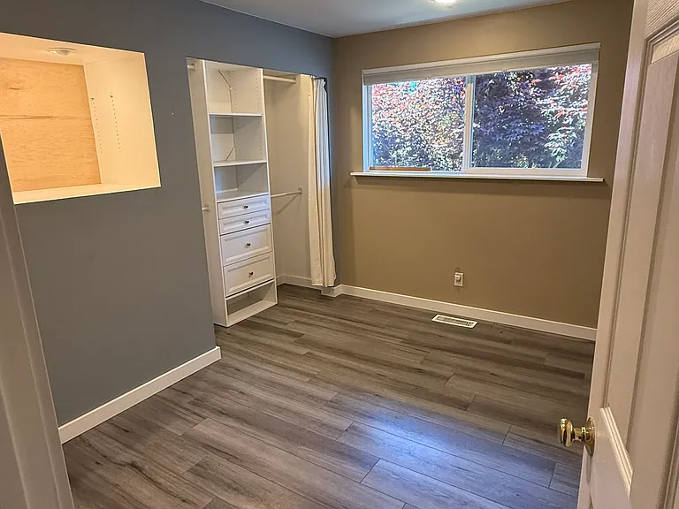 Bedroom #1 on upper level. Nice size, with customer closet and built in nook (for added storage).