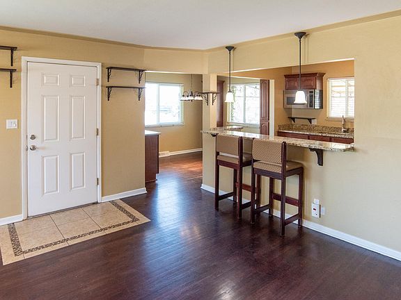 Entryway as viewed from main room looking into dining/kitchen.