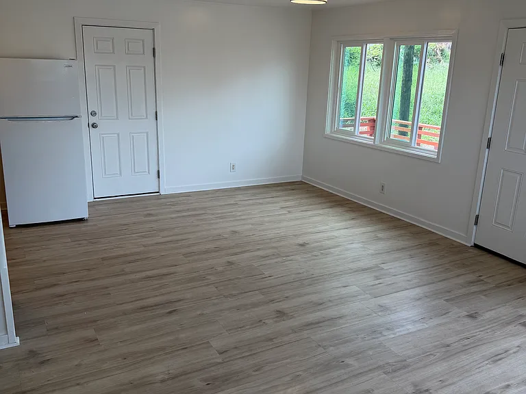 Large kitchen area. Left view of the living room.