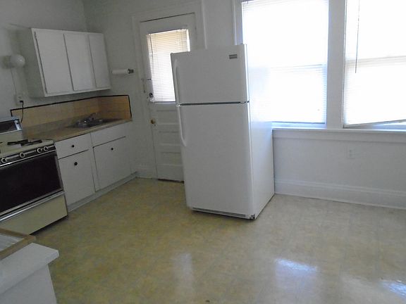 Eatin Kitchen with stove and refrigerator