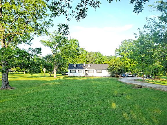 Home, yard, large driveway view