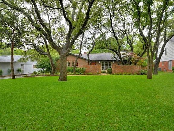 House sits very far back from street with plenty of room for a circle drive and gorgeous Oak Trees.