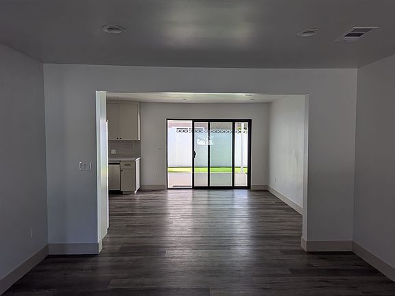 View from the living room into the dinning area/kitchen