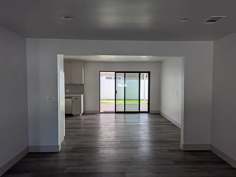 View from the living room into the dinning area/kitchen